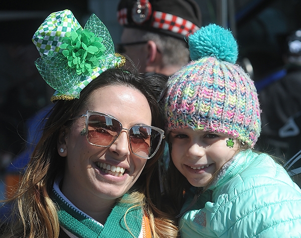 Jennifer Vaughn and her six year old daughter Azalia, of Holy Family Church, are all smiles during the City of Buffalo Annual St. Patrick's Day Parade on Delaware Avenue.  (Dan Cappellazzo/Staff Photographer)